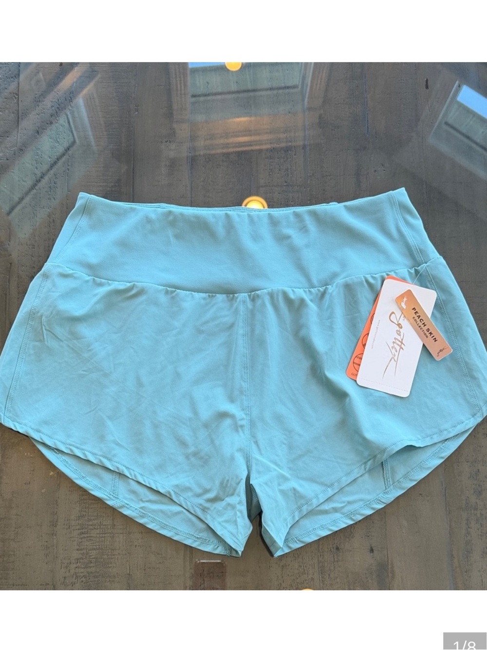 NWT Gottex Dusty Sage Women's Athletic Shorts. Size Large. Has liner. Zip pocket
